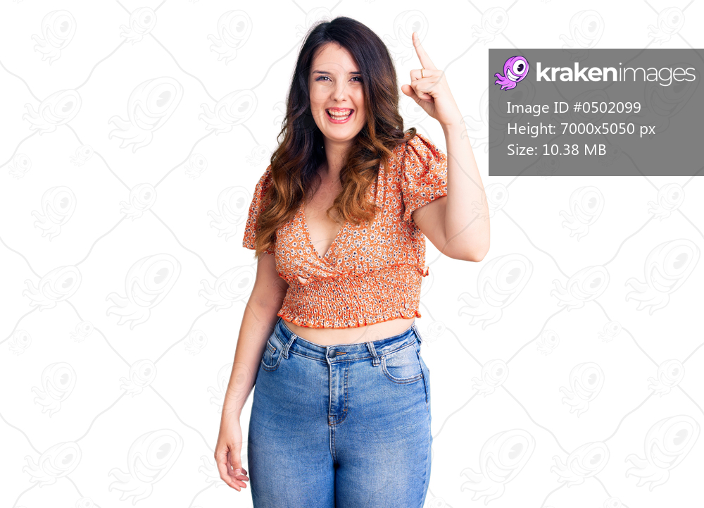Beautiful young brunette woman wearing casual clothes pointing finger up with successful idea. exited and happy. number one. 