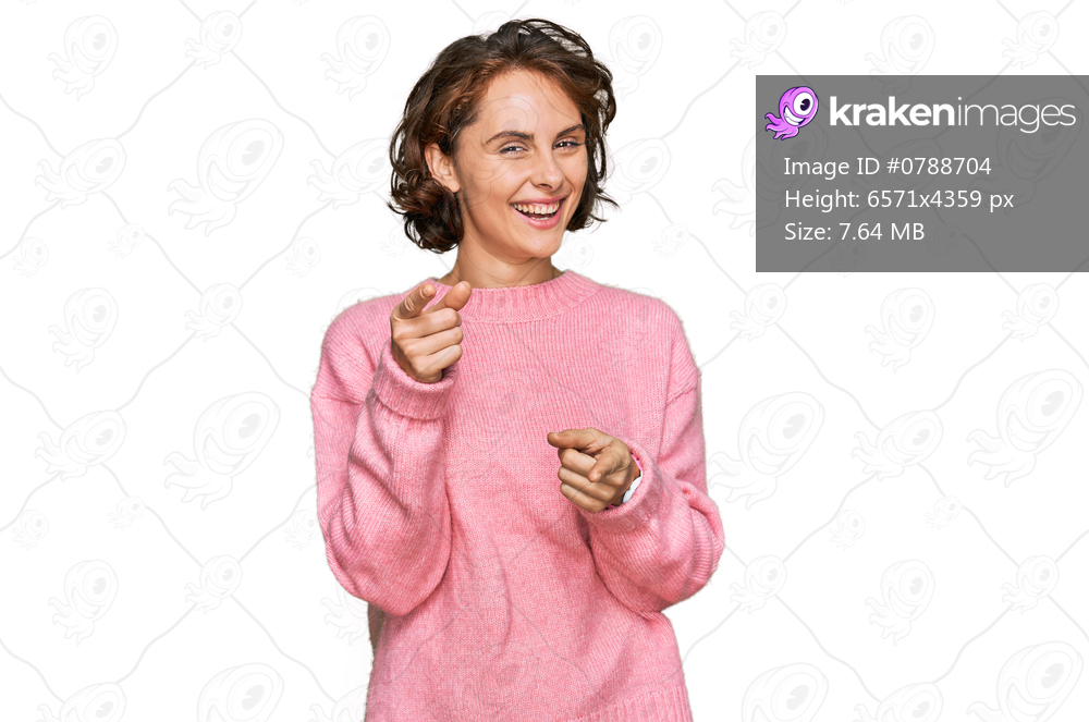 Young hispanic woman wearing casual clothes pointing fingers to camera with happy and funny face. good energy and vibes. 