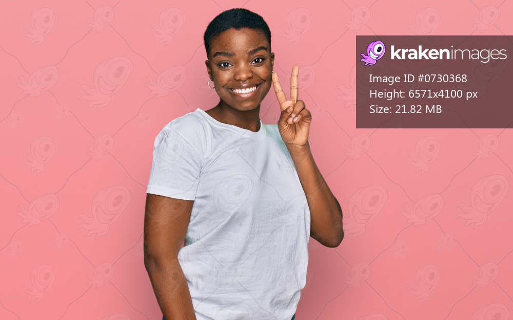 Young african american woman wearing casual white t shirt showing and pointing up with fingers number two while smiling confident and happy. 