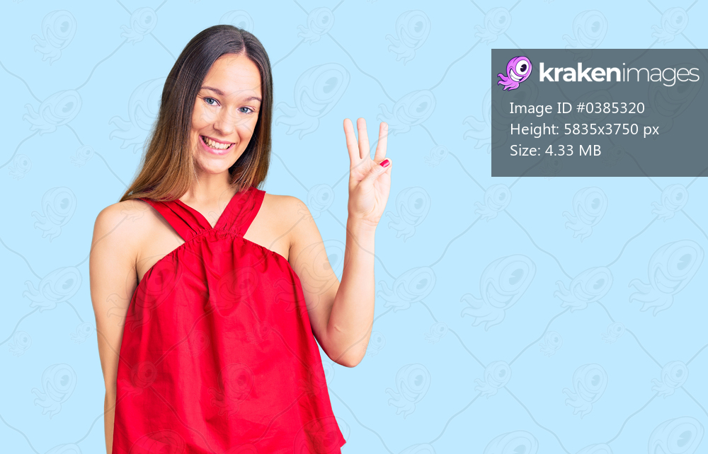 Beautiful brunette young woman wearing casual clothes showing and pointing up with fingers number three while smiling confident and happy. 