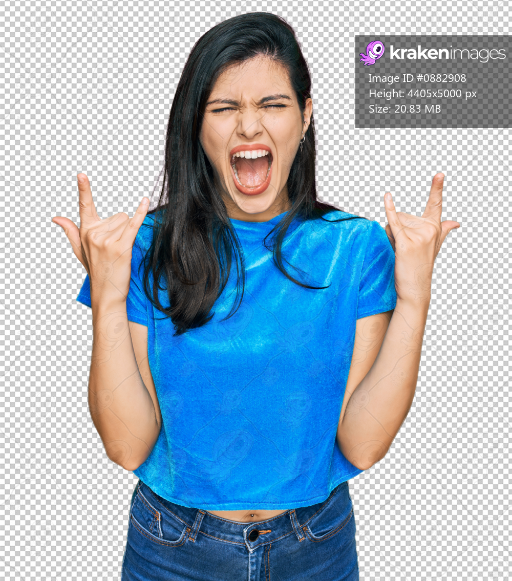 Young hispanic woman wearing casual clothes shouting with crazy expression doing rock symbol with hands up. music star. heavy concept.