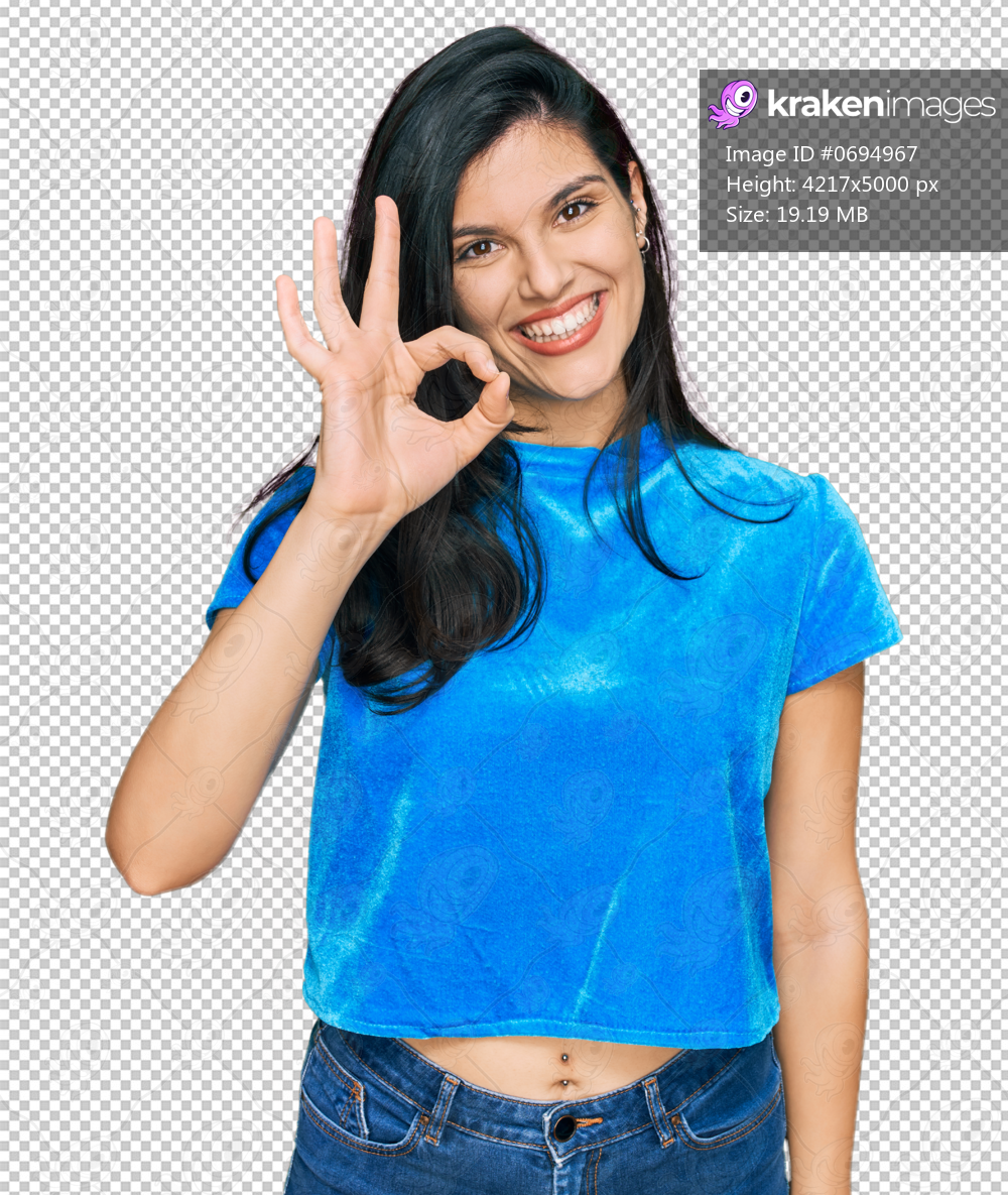 Young hispanic woman wearing casual clothes smiling positive doing ok sign with hand and fingers. successful expression.