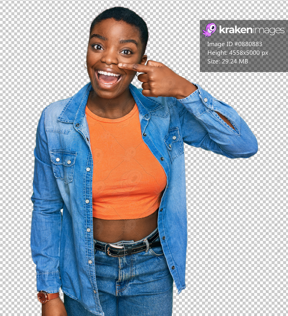 Young african american woman wearing casual clothes pointing with hand finger to face and nose, smiling cheerful. beauty concept