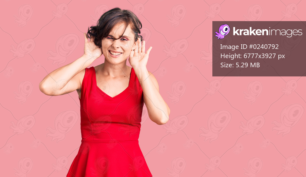 Beautiful young woman with short hair wearing casual style with sleeveless shirt trying to hear both hands on ear gesture, curious for gossip. hearing problem, deaf 
