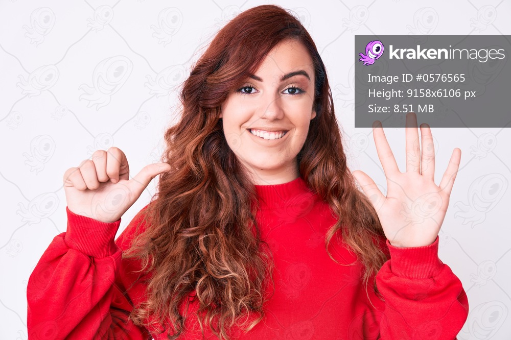 Young beautiful woman wearing casual clothes showing and pointing up with fingers number six while smiling confident and happy. 