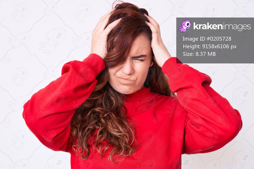 Young beautiful woman wearing casual clothes suffering from headache desperate and stressed because pain and migraine. hands on head. 