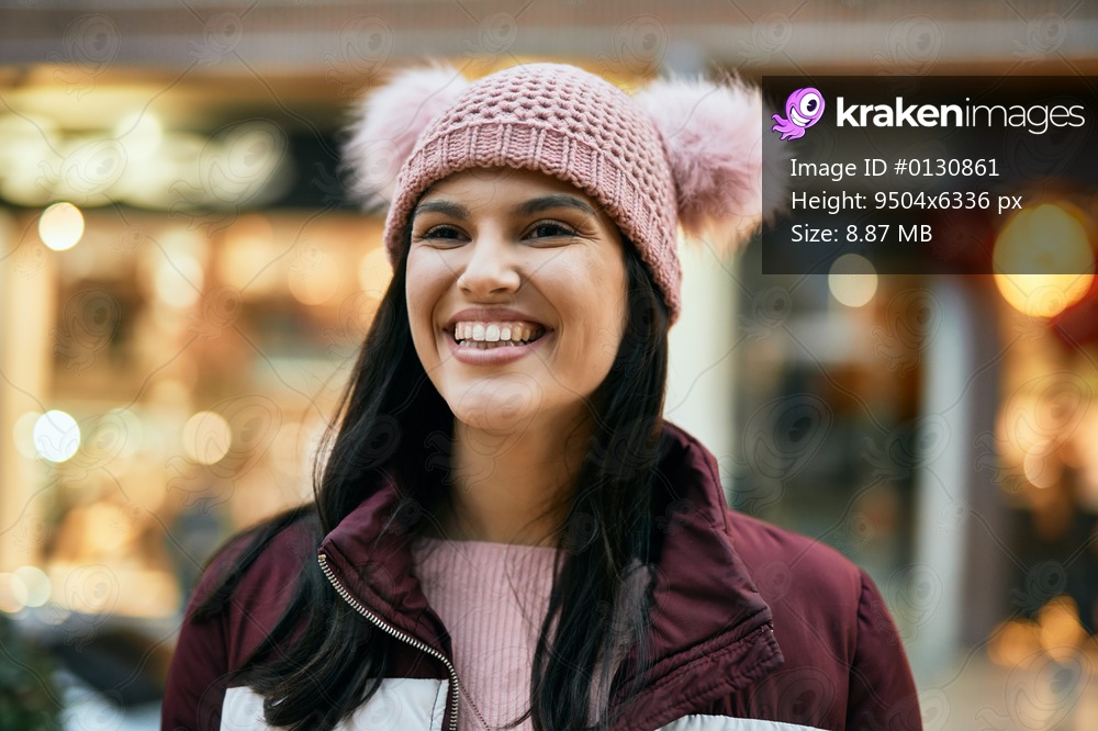Young hispanic girl smiling happy standing at the city.