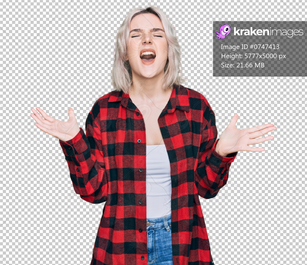 Young blonde girl wearing casual clothes crazy and mad shouting and yelling with aggressive expression and arms raised. frustration concept.