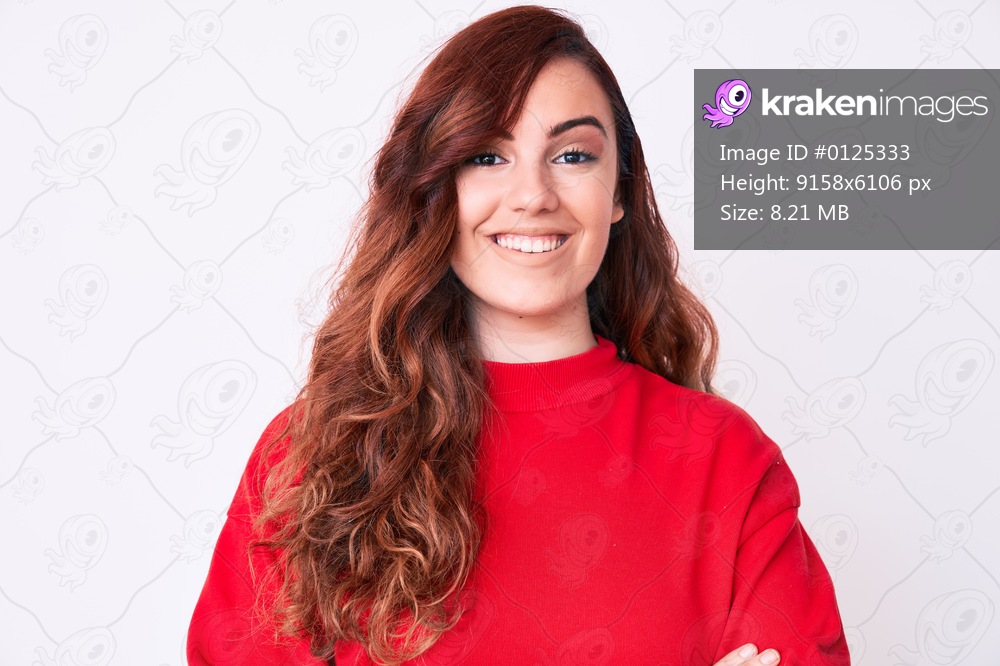 Young beautiful woman wearing casual clothes happy face smiling with crossed arms looking at the camera. positive person. 