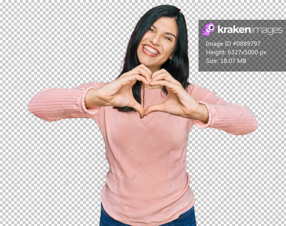 Young hispanic woman wearing casual clothes smiling in love doing heart symbol shape with hands. romantic concept.