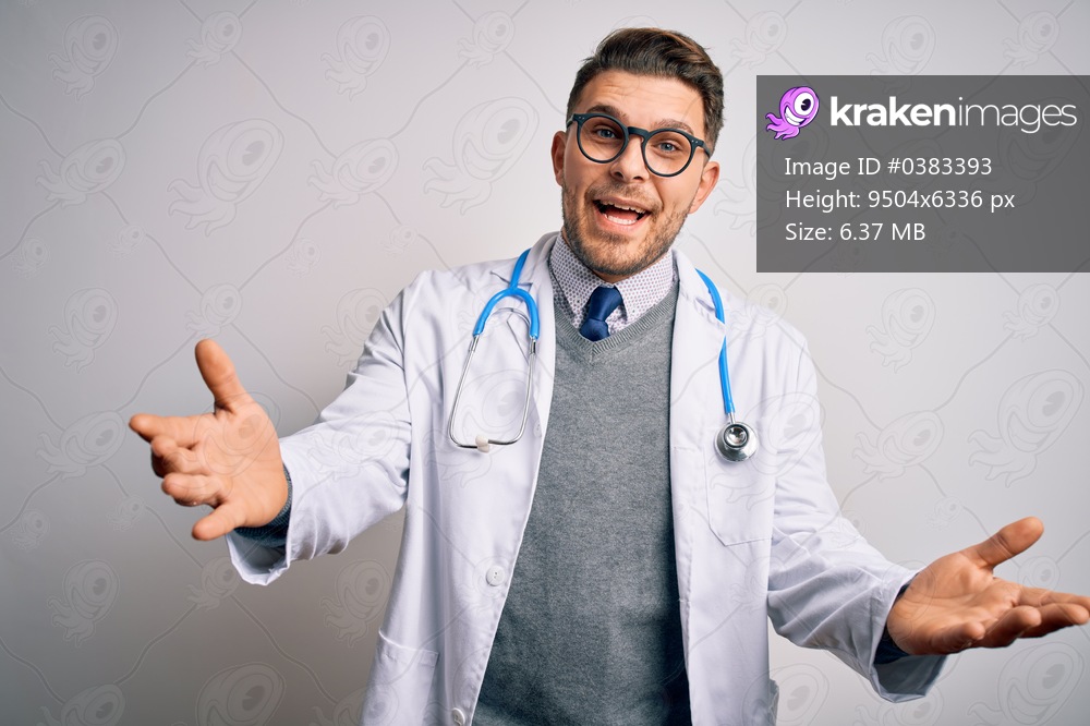 Young doctor man with blue eyes wearing medical coat and stethoscope over isolated background smiling cheerful offering hands giving assistance and acceptance.