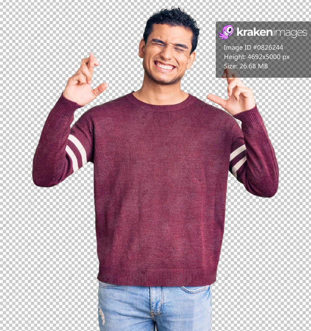 Hispanic handsome young man wearing casual clothes gesturing finger crossed smiling with hope and eyes closed. luck and superstitious concept.