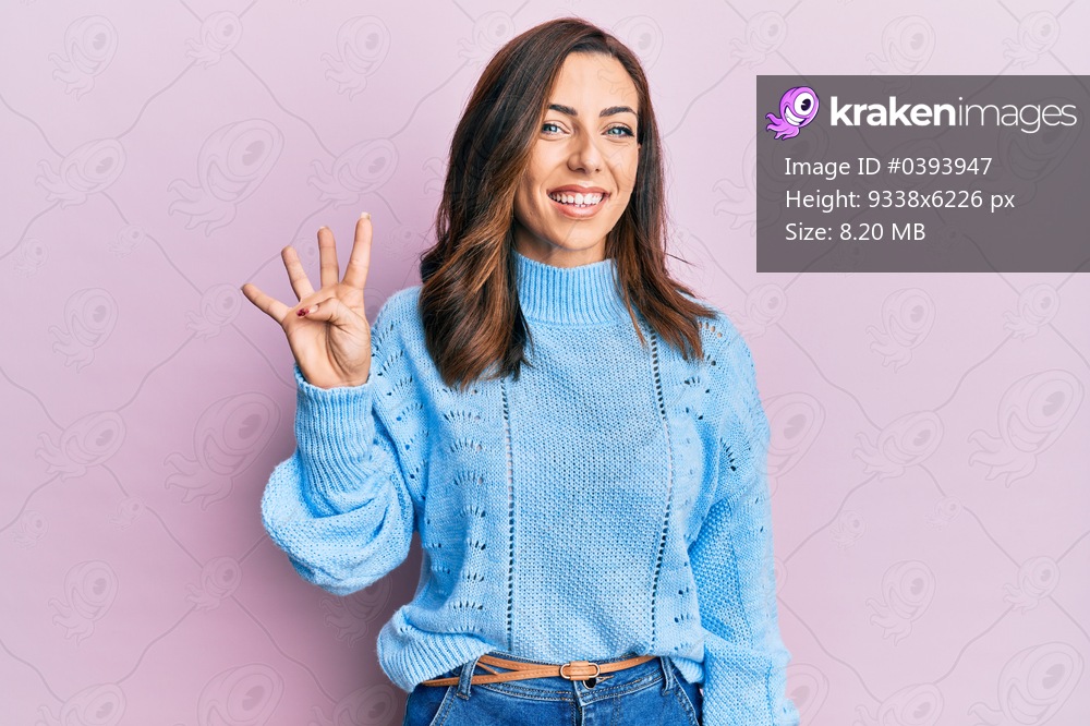Young brunette woman wearing casual winter sweater over pink background showing and pointing up with fingers number four while smiling confident and happy. 