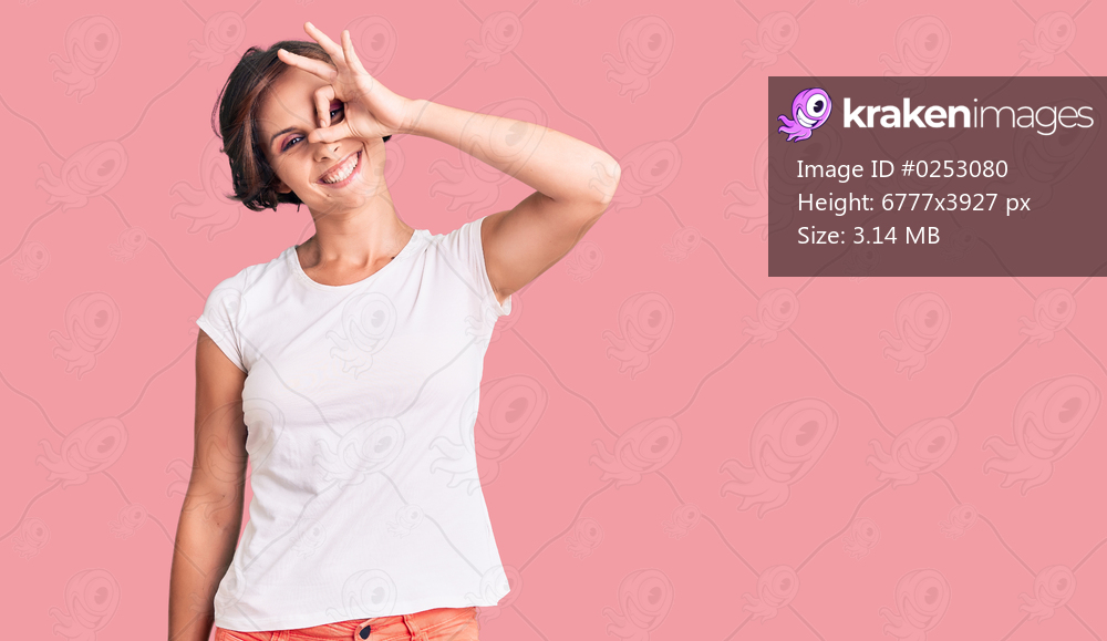 Beautiful young woman with short hair wearing casual clothes smiling happy doing ok sign with hand on eye looking through fingers 