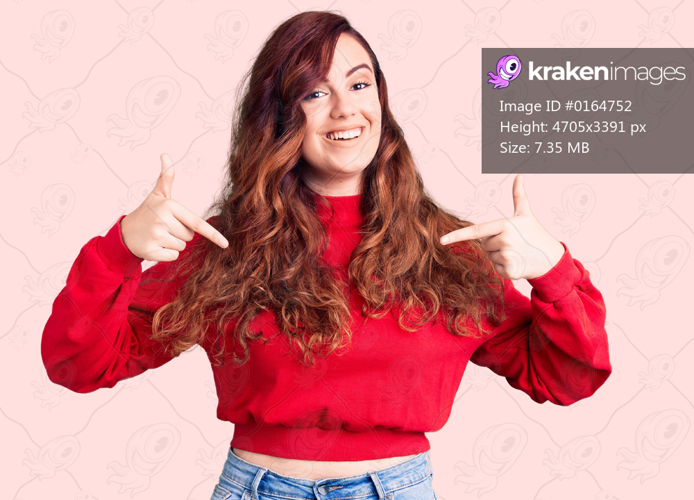 Young beautiful woman wearing casual winter sweater looking confident with smile on face, pointing oneself with fingers proud and happy. 