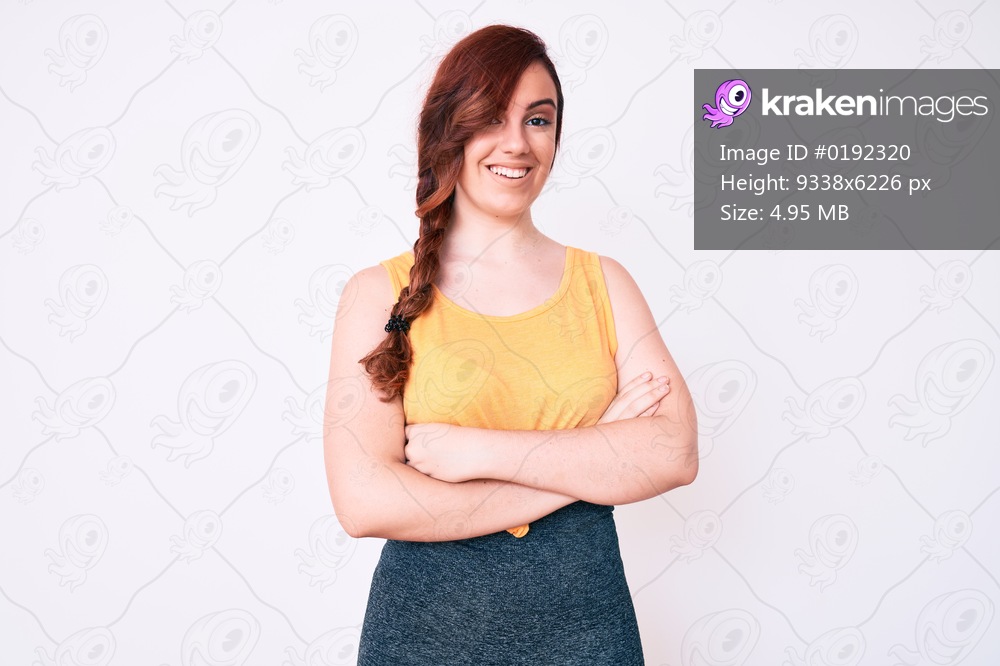 Young beautiful woman wearing casual clothes happy face smiling with crossed arms looking at the camera. positive person. 