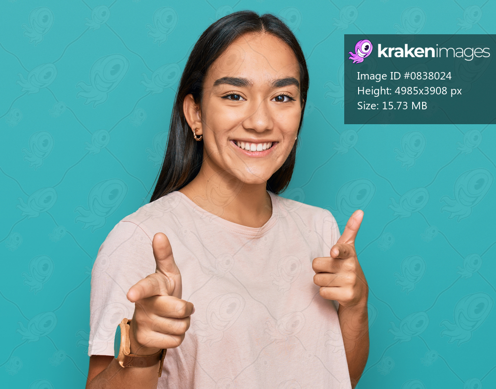 Young asian woman wearing casual clothes pointing fingers to camera with happy and funny face. good energy and vibes. 