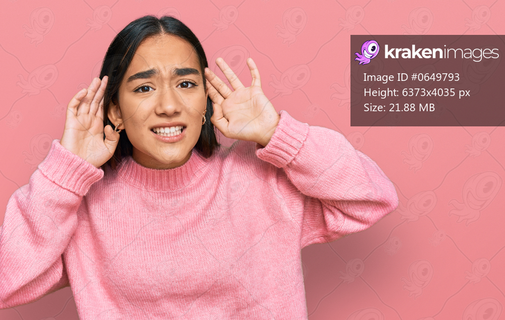 Young asian woman wearing casual winter sweater trying to hear both hands on ear gesture, curious for gossip. hearing problem, deaf 