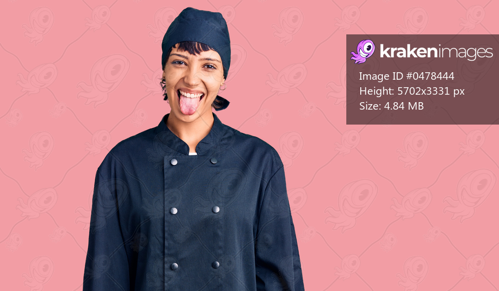 Young brunette woman with short hair wearing professional cook uniform sticking tongue out happy with funny expression. emotion concept. 