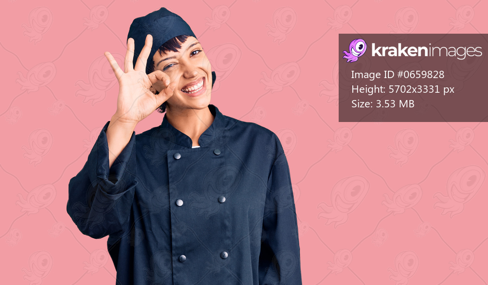 Young brunette woman with short hair wearing professional cook uniform smiling positive doing ok sign with hand and fingers. successful expression. 