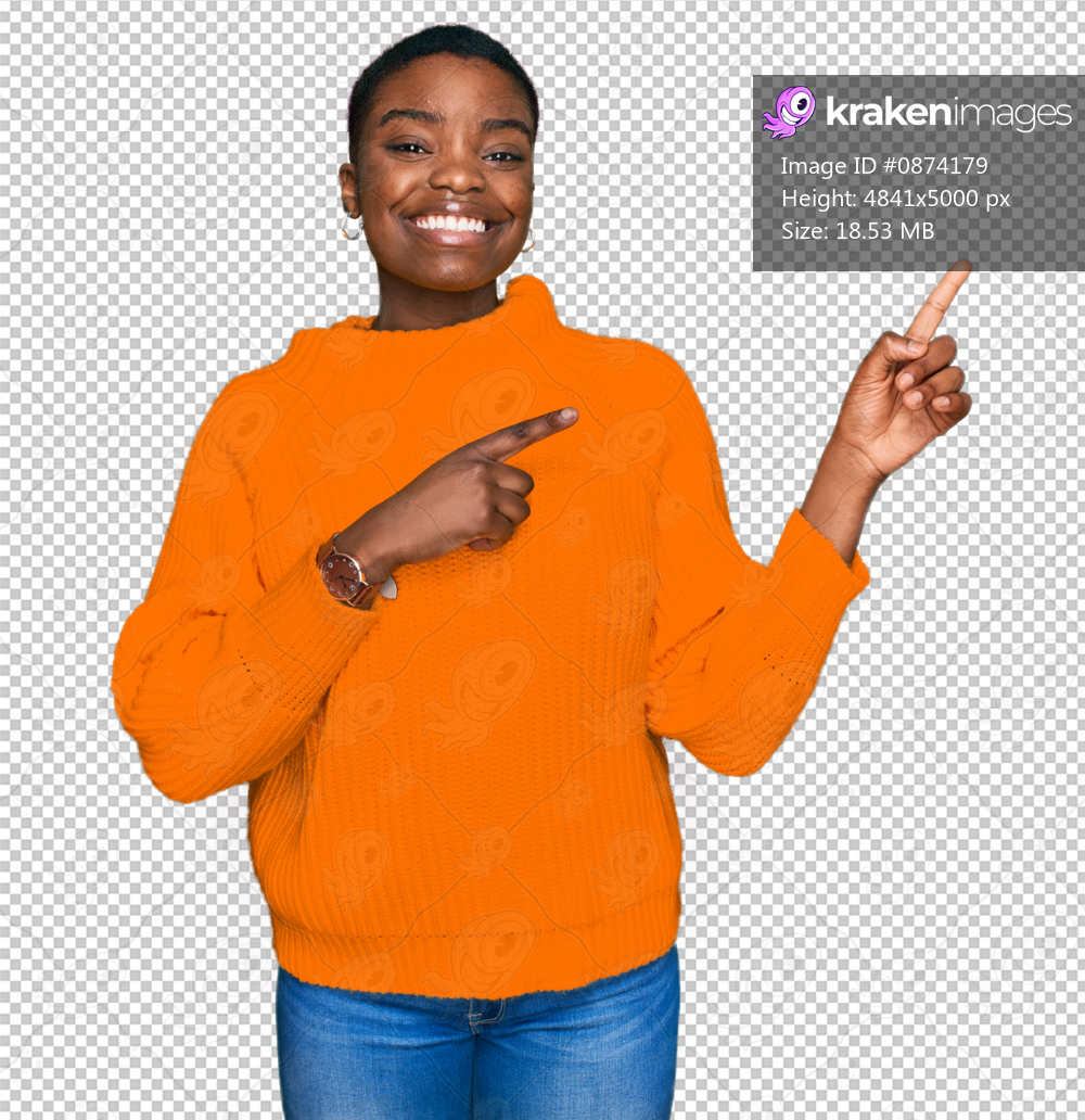 Young african american woman wearing casual clothes smiling and looking at the camera pointing with two hands and fingers to the side.