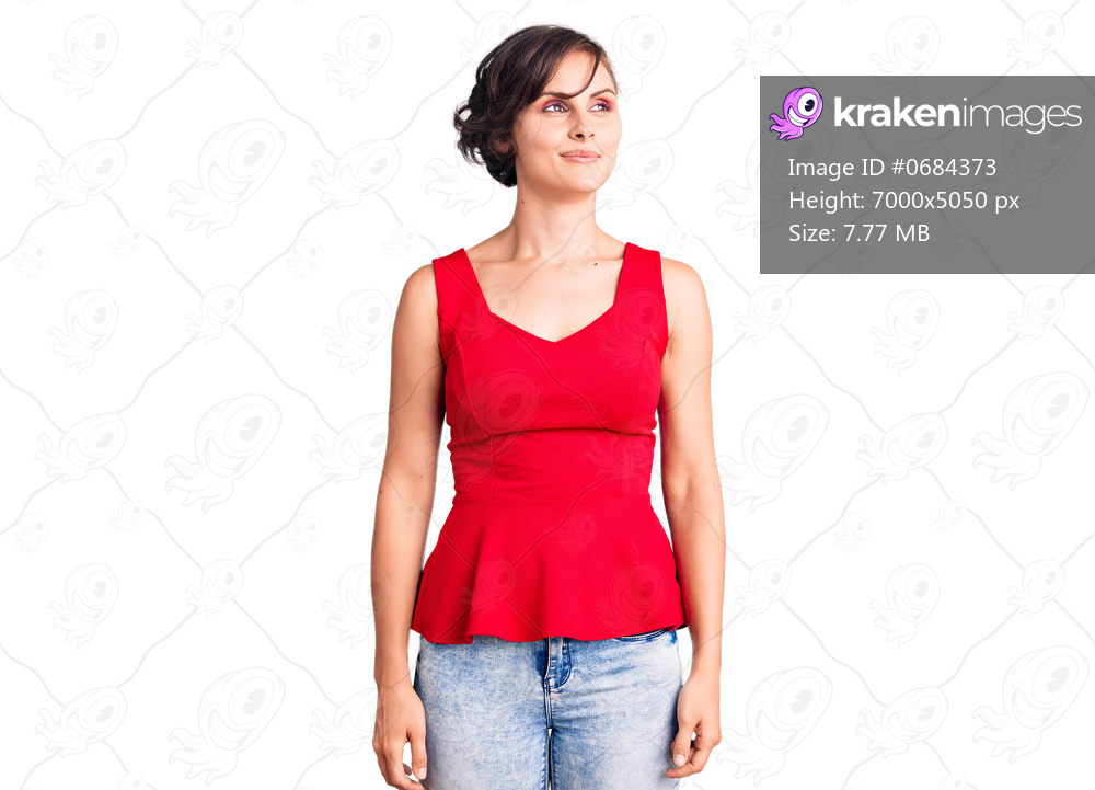 Beautiful young woman with short hair wearing casual style with sleeveless shirt smiling looking to the side and staring away thinking. 