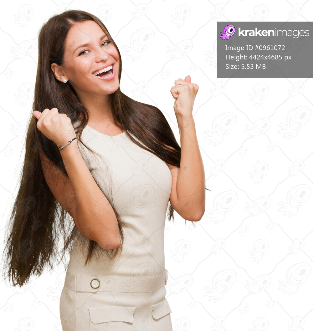 Portrait of a woman doing a success gesture against a white background