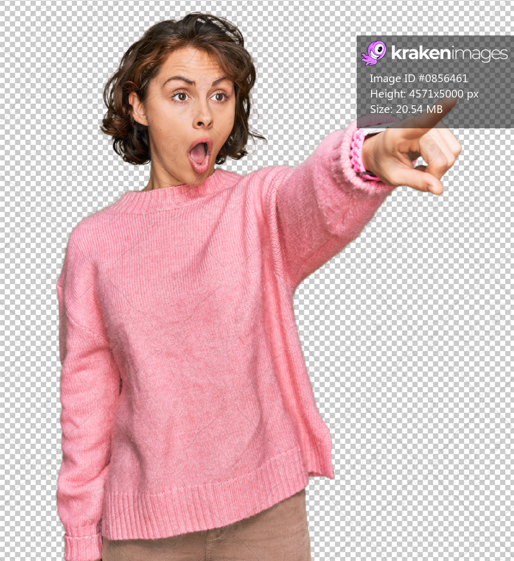 Young hispanic woman wearing casual clothes pointing with finger surprised ahead, open mouth amazed expression, something on the front
