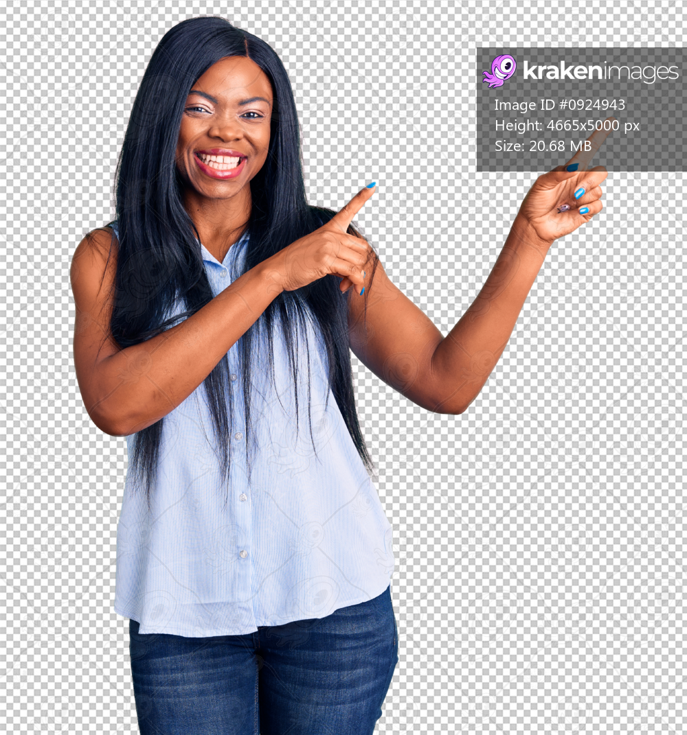 Young african american woman wearing casual clothes smiling and looking at the camera pointing with two hands and fingers to the side.