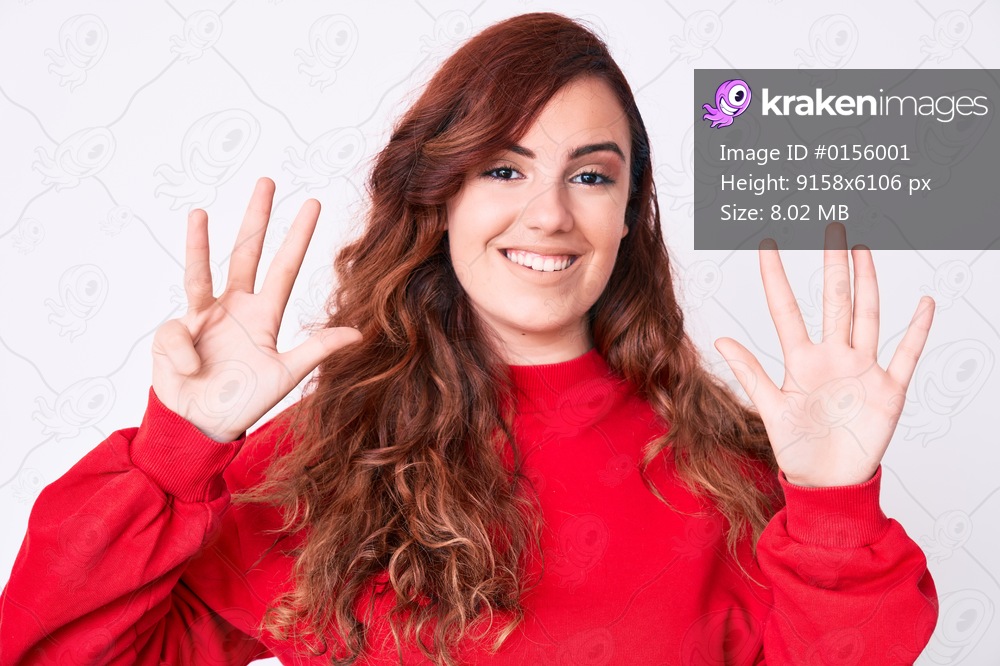 Young beautiful woman wearing casual clothes showing and pointing up with fingers number nine while smiling confident and happy. 
