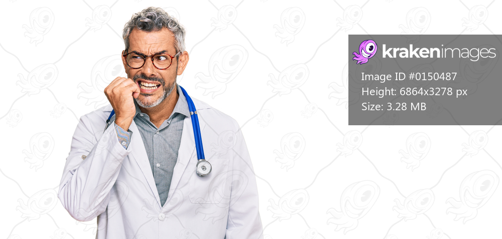 Middle age grey-haired man wearing doctor uniform and stethoscope looking stressed and nervous with hands on mouth biting nails. anxiety problem. 