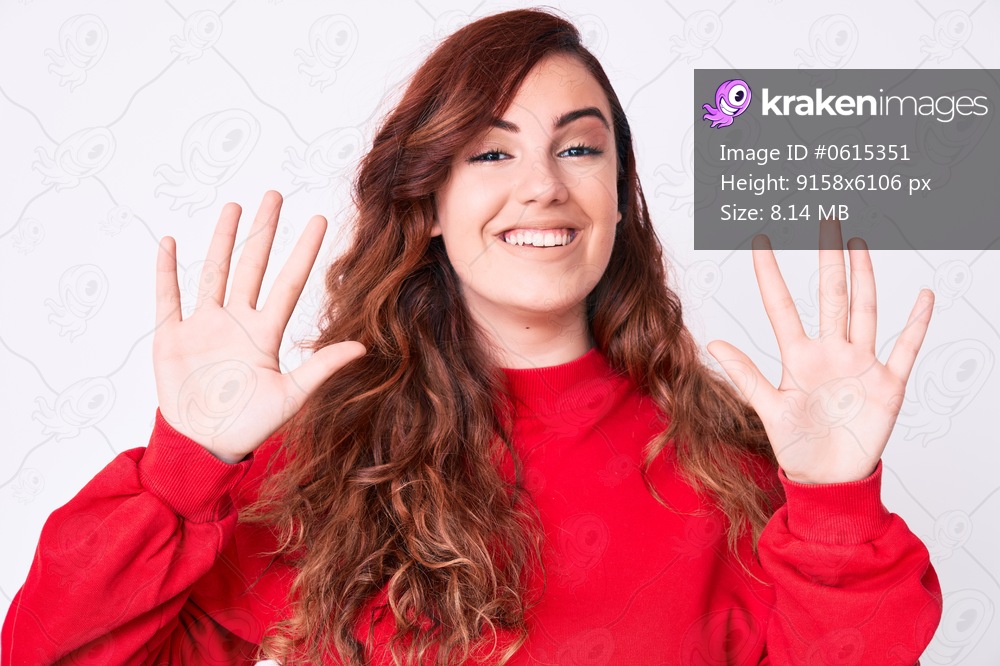 Young beautiful woman wearing casual clothes showing and pointing up with fingers number ten while smiling confident and happy. 