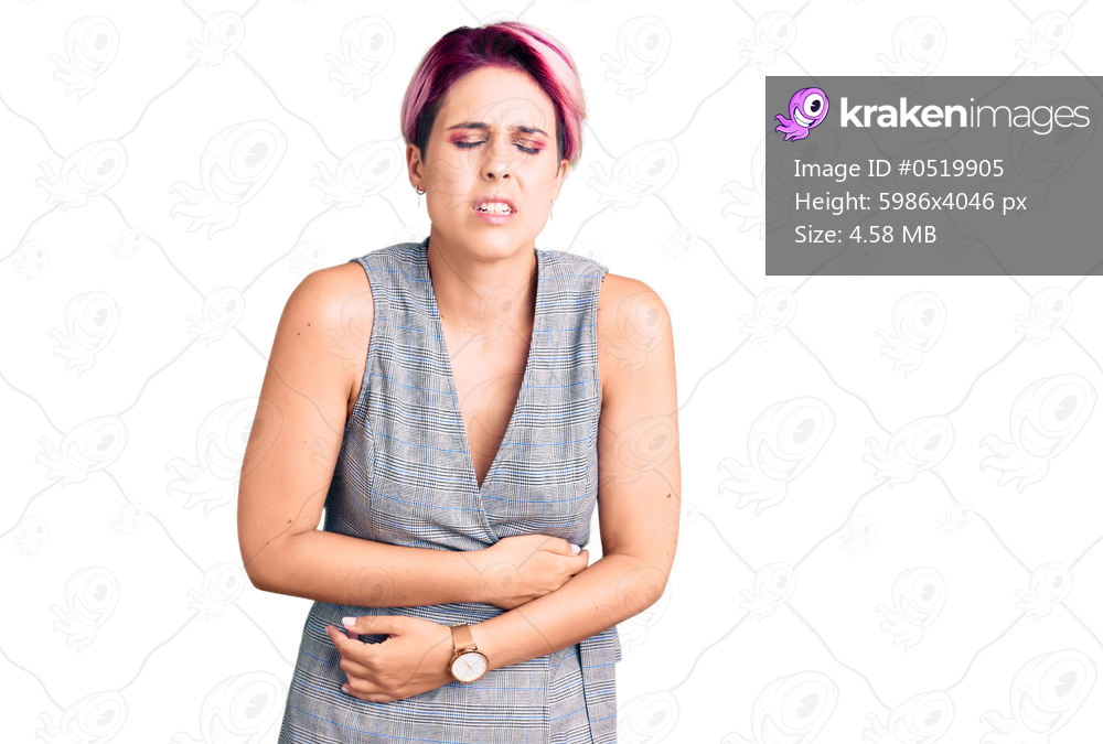 Young beautiful woman with pink hair wearing casual clothes with hand on stomach because indigestion, painful illness feeling unwell. ache concept. 