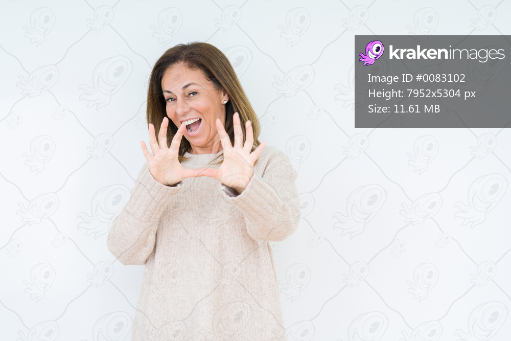 Beautiful middle age woman over isolated background afraid and terrified with fear expression stop gesture with hands, shouting in shock. Panic concept.