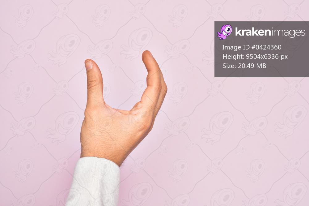 Hand of caucasian young man showing fingers over isolated pink background picking and taking invisible thing, holding object with fingers showing space