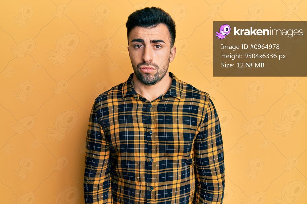 Young hispanic man wearing casual clothes depressed and worry for distress, crying angry and afraid. sad expression. 