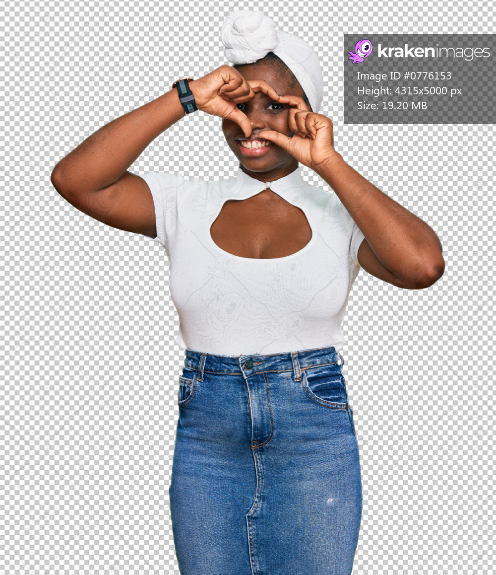 Young african woman with turban wearing hair turban over isolated background doing heart shape with hand and fingers smiling looking through sign