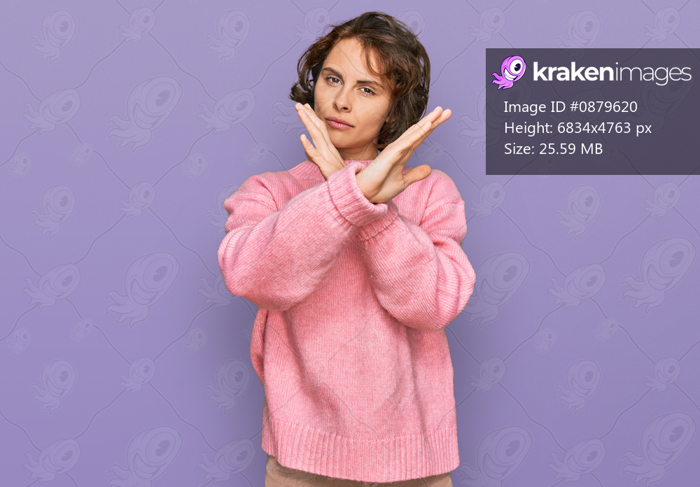 Young hispanic woman wearing casual clothes rejection expression crossing arms doing negative sign, angry face 