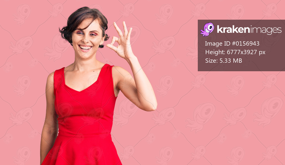 Beautiful young woman with short hair wearing casual style with sleeveless shirt smiling positive doing ok sign with hand and fingers. successful expression. 