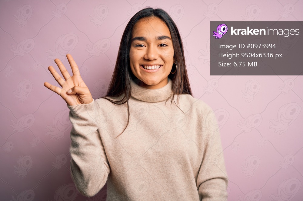 Young beautiful asian woman wearing casual turtleneck sweater over pink background showing and pointing up with fingers number four while smiling confident and happy.