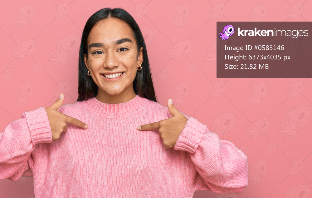 Young asian woman wearing casual winter sweater looking confident with smile on face, pointing oneself with fingers proud and happy. 