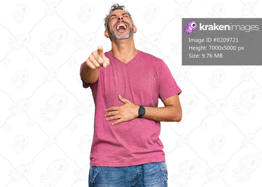 Middle age grey-haired man wearing casual clothes laughing at you, pointing finger to the camera with hand over body, shame expression 