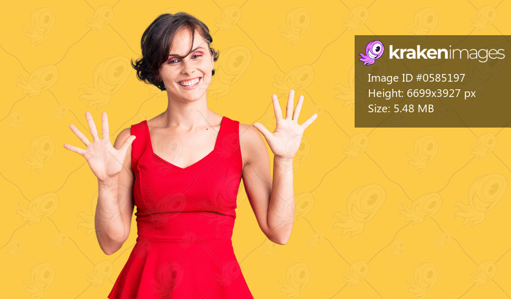 Beautiful young woman with short hair wearing casual style with sleeveless shirt showing and pointing up with fingers number ten while smiling confident and happy. 