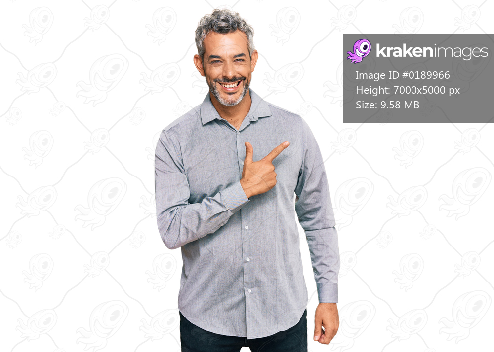 Middle age grey-haired man wearing casual clothes cheerful with a smile of face pointing with hand and finger up to the side with happy and natural expression on face 