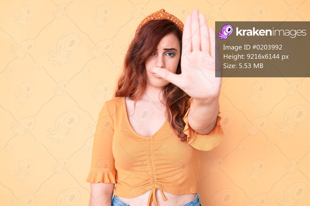 Young beautiful woman wearing casual clothes doing stop sing with palm of the hand. warning expression with negative and serious gesture on the face. 