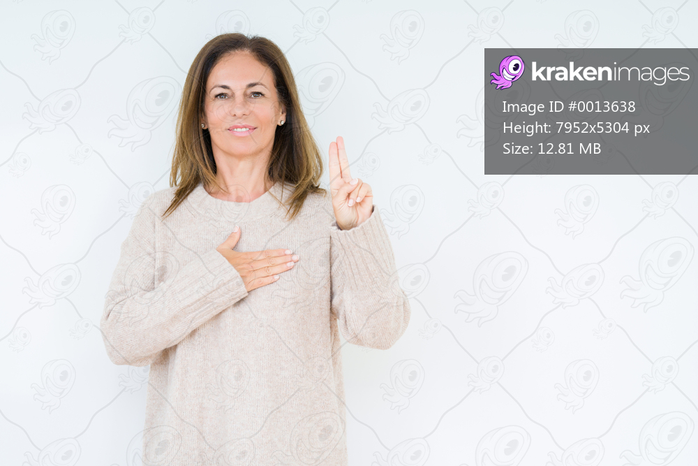 Beautiful middle age woman over isolated background Swearing with hand on chest and fingers, making a loyalty promise oath