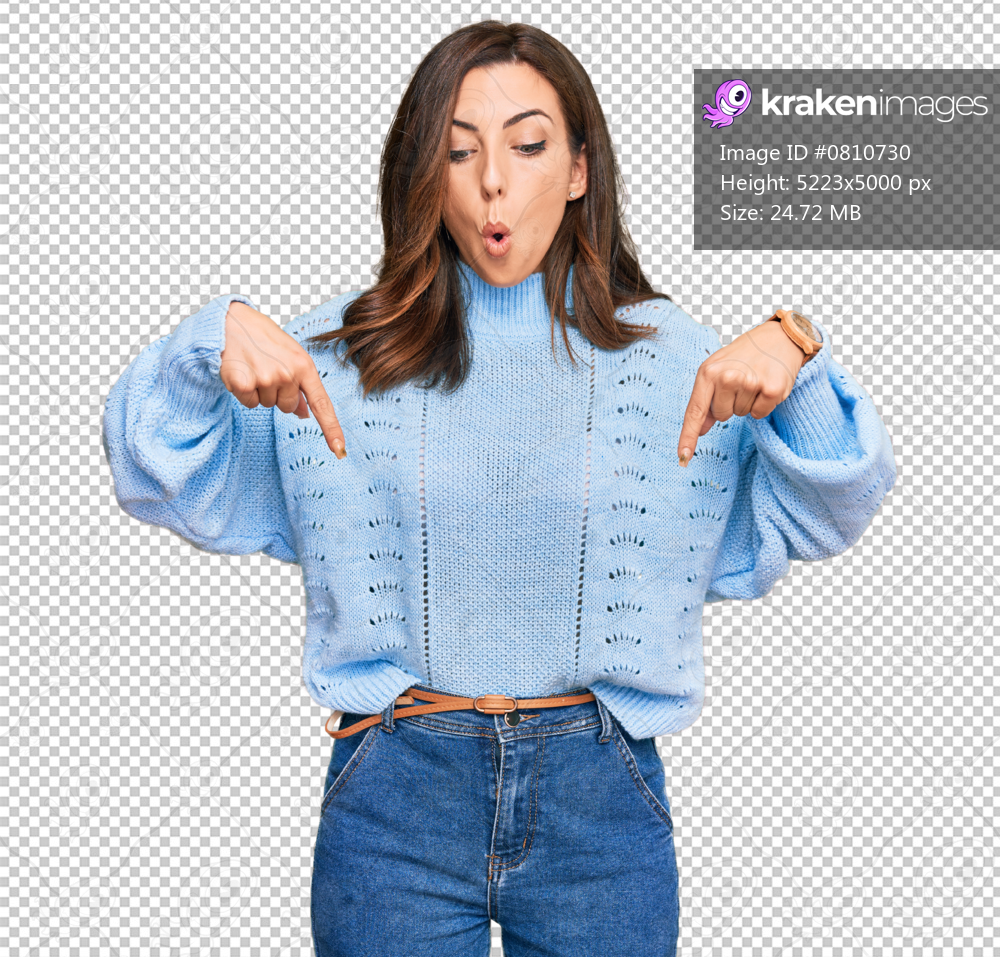 Young brunette woman wearing casual winter sweater pointing down with fingers showing advertisement, surprised face and open mouth