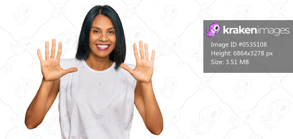 Young african american woman wearing casual clothes showing and pointing up with fingers number ten while smiling confident and happy. 