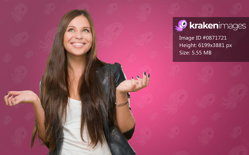 Portrait Of A Happy Woman against a pink background
