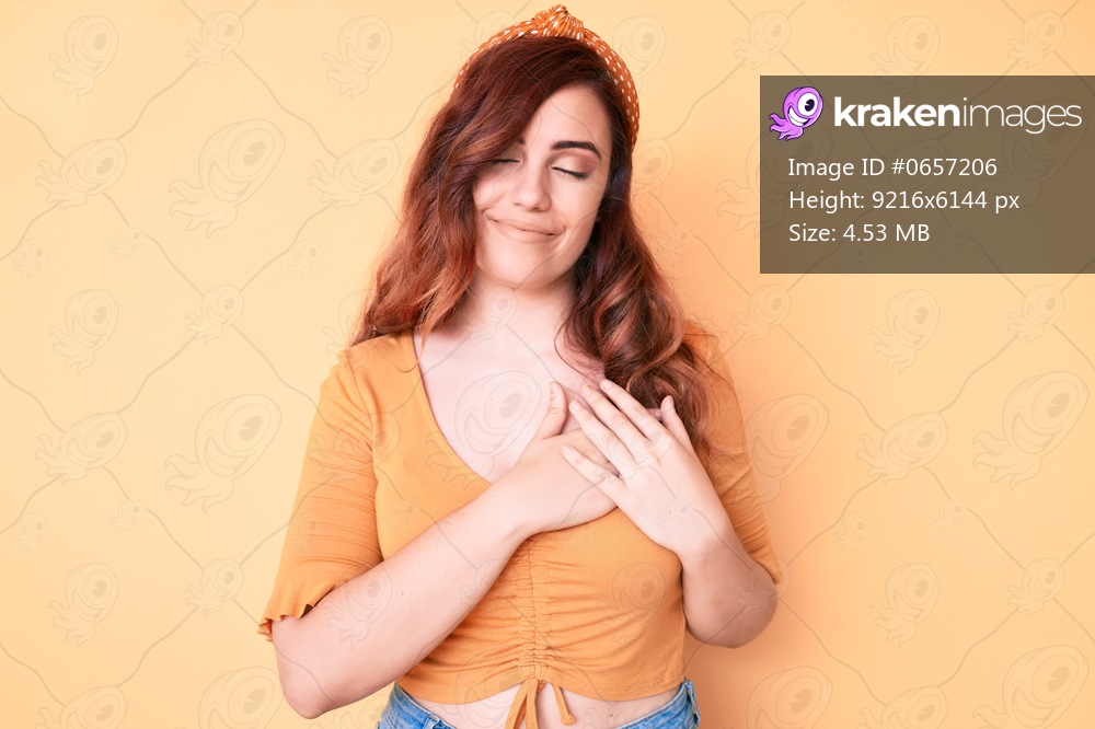 Young beautiful woman wearing casual clothes smiling with hands on chest with closed eyes and grateful gesture on face. health concept. 